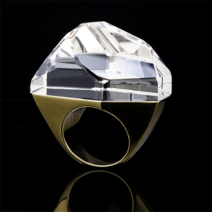 Luxury DVF Iceberg ring photographed with controlled studio lighting against black background for high-end jewelry photography.